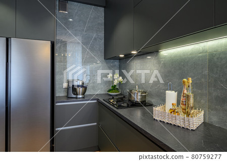 Modern large luxury dark gray kitchen closeup Modern large luxury dark gray kitchen closeup 80759277