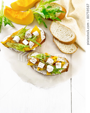 Bruschetta with pumpkin and ricotta on board top Bruschetta with pumpkin and ricotta on board top 80759587
