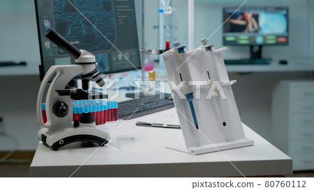 Scientific micropipette and microscope in laboratory Scientific micropipette and microscope in laboratory 80760112