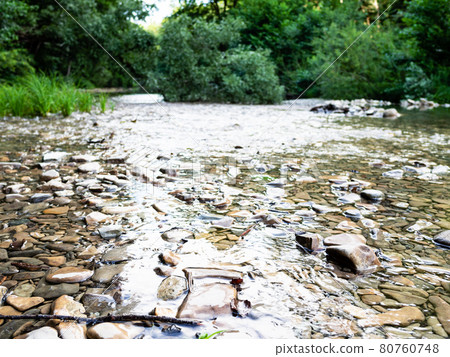 water stream flows in stone bed of mountain river water stream flows in stone bed of mountain river 80760748