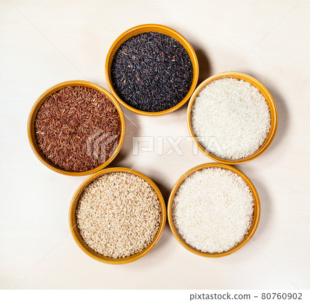 top view of various rice grains in ceramic bowls 80760902