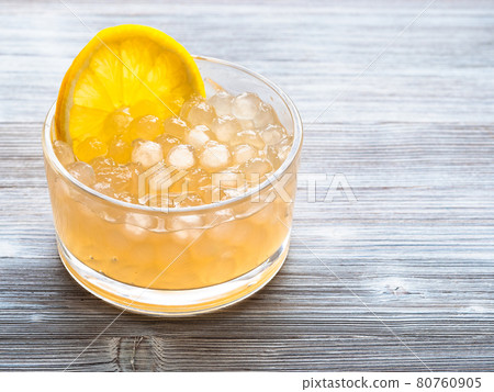 boba bubbles with lemon slice in bowl on gray boba bubbles with lemon slice in bowl on gray 80760905