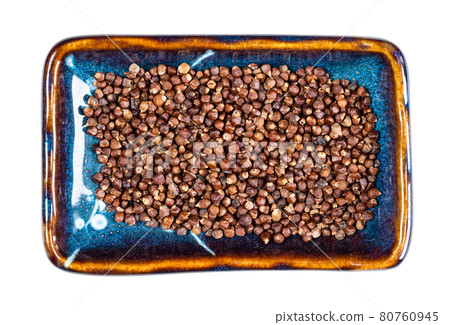 grains of paradise pepper on plate cutout grains of paradise pepper on plate cutout 80760945