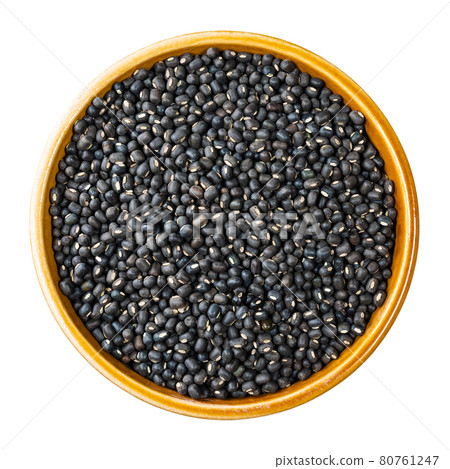 raw whole black urad beans in round bowl cutout raw whole black urad beans in round bowl cutout 80761247