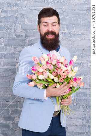Macho getting ready romantic date. Tulips for sweetheart. Macho getting ready romantic date. Tulips for sweetheart. 80761351