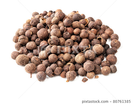 pile of allspice (jamaica pepper) closeup on white 80761385