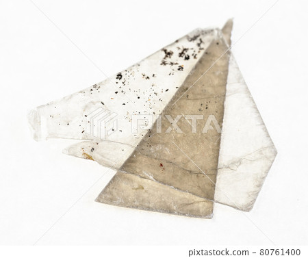 rough muscovite mica (common mica) sheets on white rough muscovite mica (common mica) sheets on white 80761400