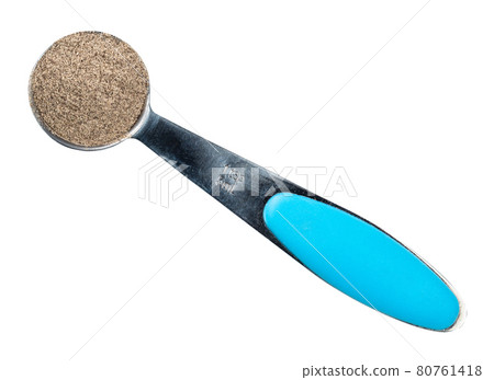 ground black pepper in measuring teaspoon cutout ground black pepper in measuring teaspoon cutout 80761418