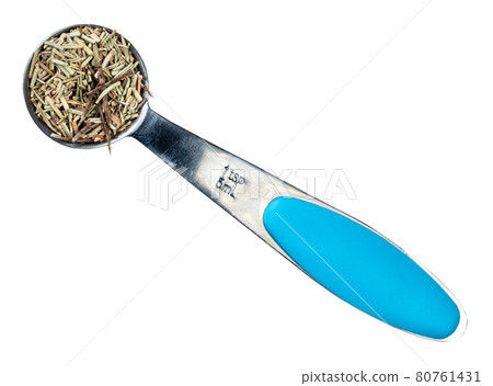 dried rosemary leaves in measuring teaspoon cutout dried rosemary leaves in measuring teaspoon cutout 80761431