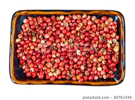 pink peppercorns (Baie rose) in bowl cutout 80761449