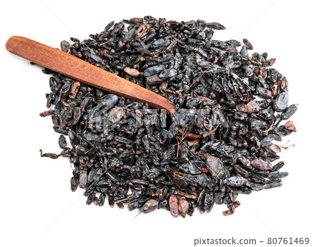 wood spoon on pile of Berberis fruits on white 80761469