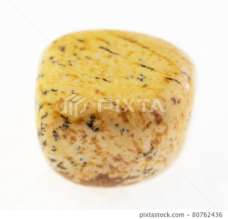 polished yellow sandy jasper stone on white 80762436