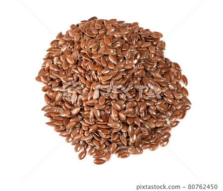 handful of brown flax seeds closeup on white 80762450