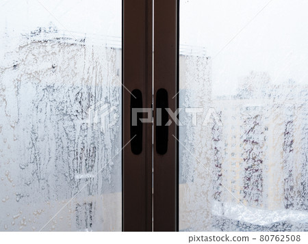 frosty home window in house in city in winter frosty home window in house in city in winter 80762508