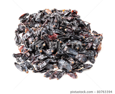 pile of black Berberis fruits closeup on white 80763394