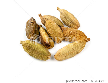 several dried Cardamom pods closeup on white 80763395