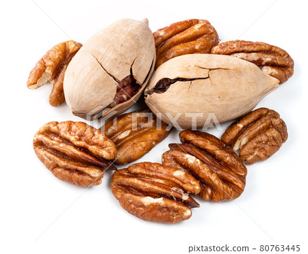 shelled and unshelled pecan nuts closeup on white shelled and unshelled pecan nuts closeup on white 80763445