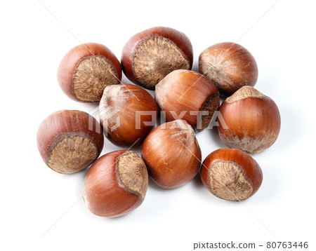handful of unshelled hazelnuts closeup on white handful of unshelled hazelnuts closeup on white 80763446