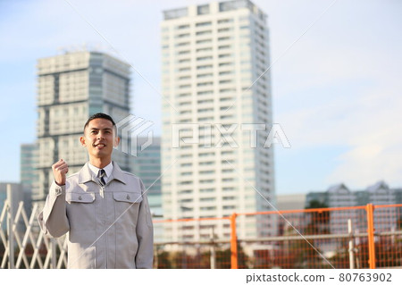 Uniform clock, office worker, new employee, worker, business, outdoor, young man, building, corona, sales copy space 80763902