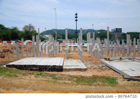 MELAKA, MALAYSIA -SEPTEMBER 18, 2016: Concrete pile driven at the construction site using the piling machine. MELAKA, MALAYSIA -SEPTEMBER 18, 2016: Concrete pile driven at the construction site using the piling machine. 80764710