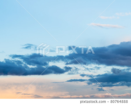 dark clouds in blue sky at spring sunset 80764888