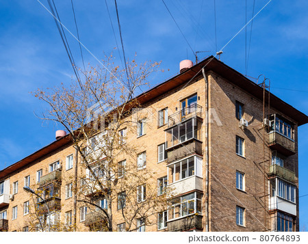 electrical wires over typical urban house electrical wires over typical urban house 80764893