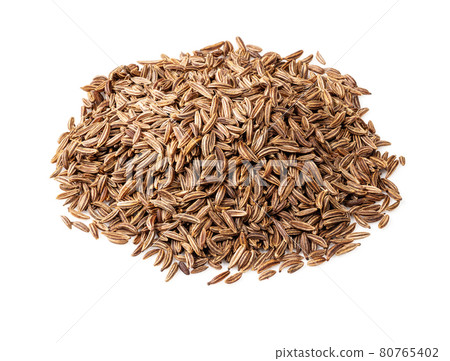 handful of caraway fruits closeup on white 80765402