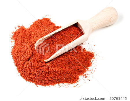 wooden scoop on pile of paprika powder on white wooden scoop on pile of paprika powder on white 80765445