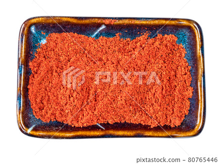 top view of paprika powder in ceramic bowl cutout top view of paprika powder in ceramic bowl cutout 80765446