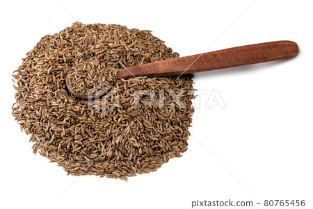 wooden spoon on pile of caraway fruits on white 80765456
