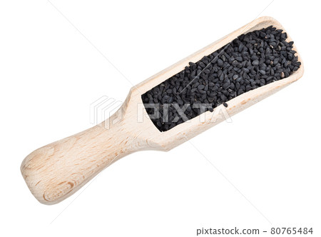 Nigella sativa seeds in wood scoop cutout Nigella sativa seeds in wood scoop cutout 80765484