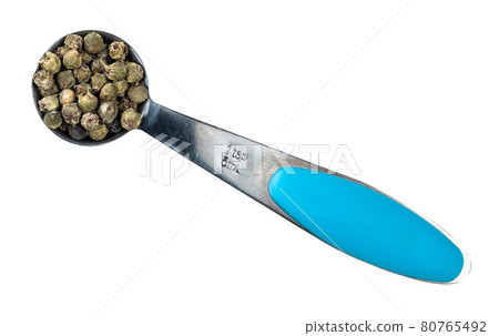 green pepper peppercorns in spoon cutout green pepper peppercorns in spoon cutout 80765492