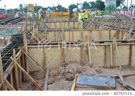 JOHOR, MALAYSIA -JULY 23, 2016: Timber form work made from plywood and timber constructed by workers at the construction site. JOHOR, MALAYSIA -JULY 23, 2016: Timber form work made from plywood and timber constructed by workers at the construction site. 80765518