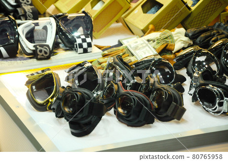 PORT DICKSON, MALAYSIA -SEPTEMBER 04, 2016: Motorcycle google display on the desk. PORT DICKSON, MALAYSIA -SEPTEMBER 04, 2016: Motorcycle google display on the desk. 80765958