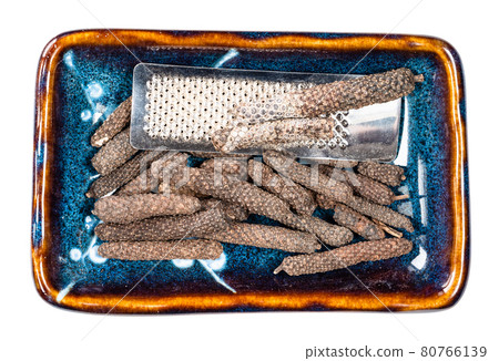 java long pepper and grater in ceramic bowl cutout 80766139