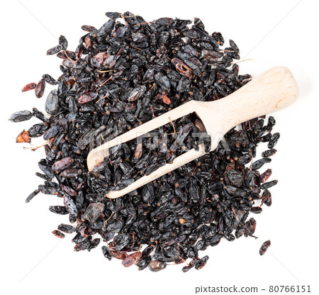 scoop on pile of black Berberis fruits on white 80766151