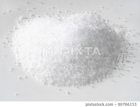 handful of fructose crystalline sugar on white handful of fructose crystalline sugar on white 80766153