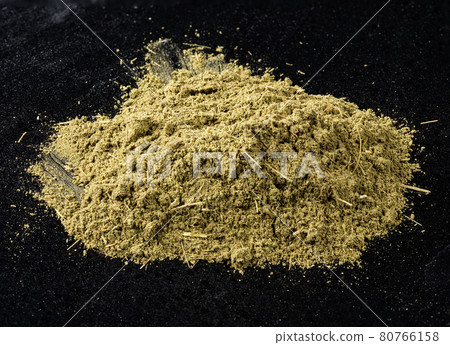 pile of powder of stevia rebaudiana herb on black pile of powder of stevia rebaudiana herb on black 80766158