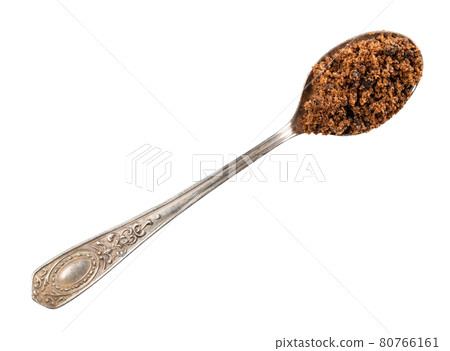 dark muscovado sugar in silver teaspoon cutout dark muscovado sugar in silver teaspoon cutout 80766161