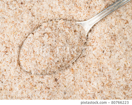 top view of silver teaspoon in Psyllium husk 80766223