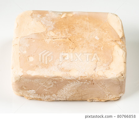 fresh compressed yeast cake on white plate 80766858