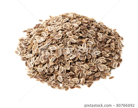handful of dill seeds closeup on white 80766892