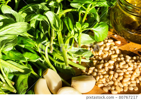 Pesto ingredients on table illuminated by sun Pesto ingredients on table illuminated by sun 80767217