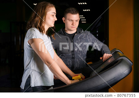Workout in the gym on a treadmill. Workout in the gym on a treadmill. 80767355