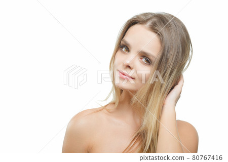 Portrait of young attractive woman with closed eyes over white background. 80767416