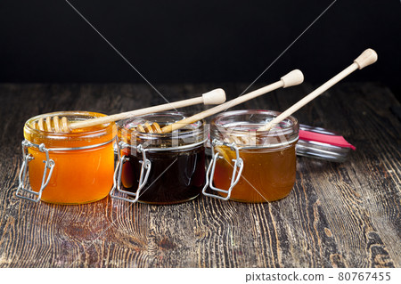 delicious and natural linden honey collected by honey bees delicious and natural linden honey collected by honey bees 80767455