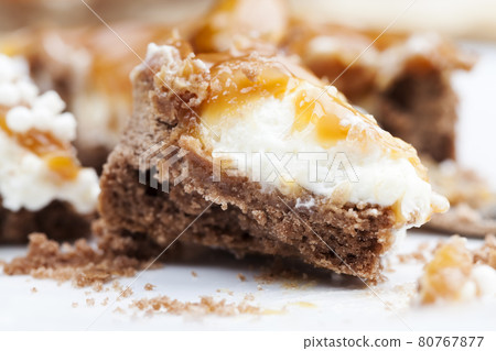 tartlet with milk cheese filling and lots of salted caramel with nuts tartlet with milk cheese filling and lots of salted caramel with nuts 80767877