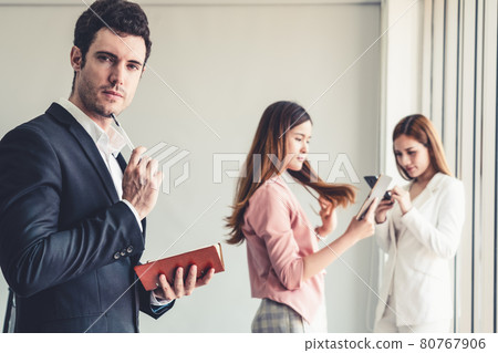 Businessman reading book in business office . Businessman reading book in business office . 80767906