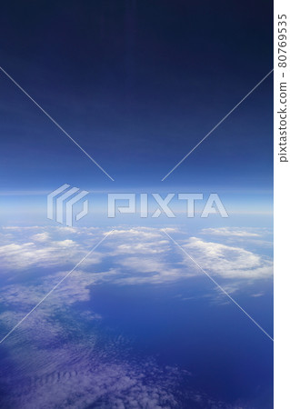 beautiful white clouds in blue sky, view from an air plane window. beautiful white clouds in blue sky, view from an air plane window. 80769535