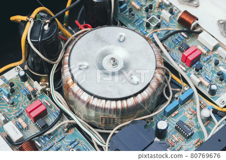 Toroidal transformer in electrical for step down AC voltage of electrical appliance 80769676